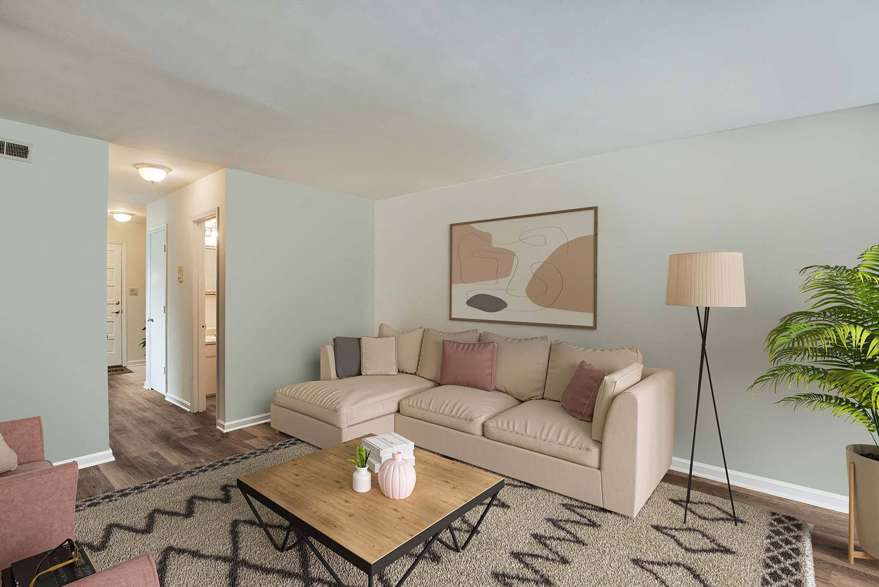 a living room with a couch and a table at Randolph Park, Charlotte, NC